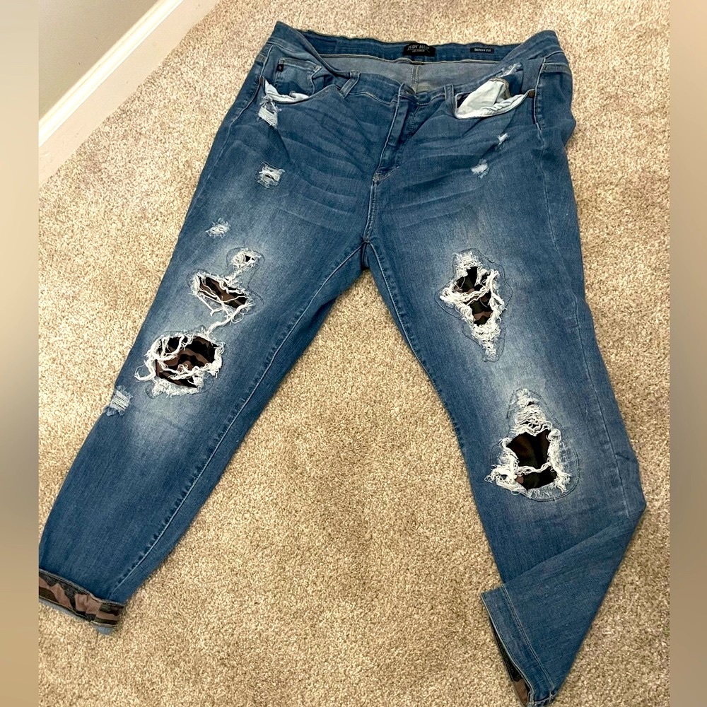 Distressed camo jeans